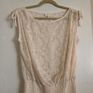 Cream lace top with ties.
